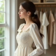Ruffled Smocked Blouse with Bow Detail